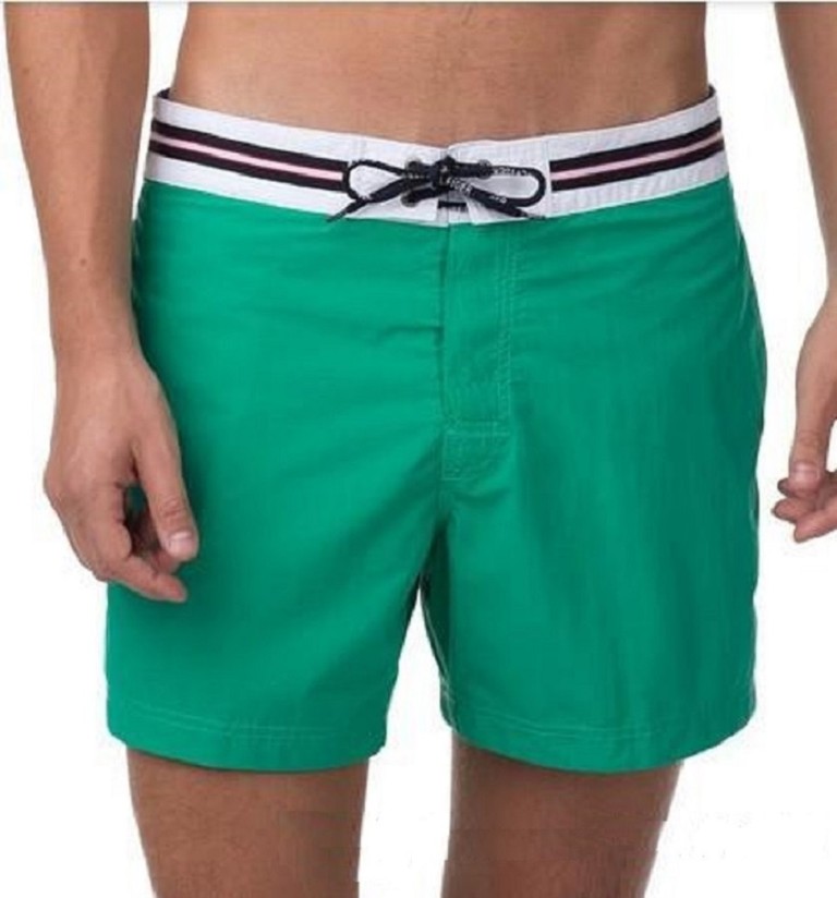 solid board shorts – green